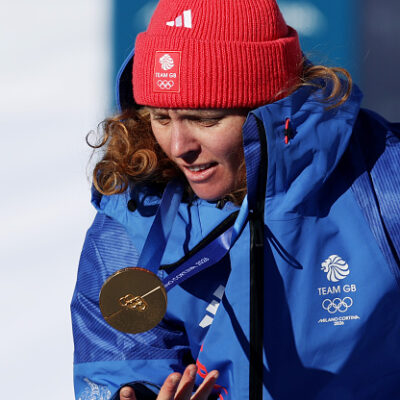 LIVIGNO, ITALY - FEBRUARY 15: Gold medalist Charlotte Bankes of Team Great Britain interacts with her medal during the medal ceremony for the Mixed Team Snowboard Cross on day nine of the Milano Cortina 2026 Winter Olympic games at Livigno Snow Park on February 15, 2026 in Livigno, Italy.